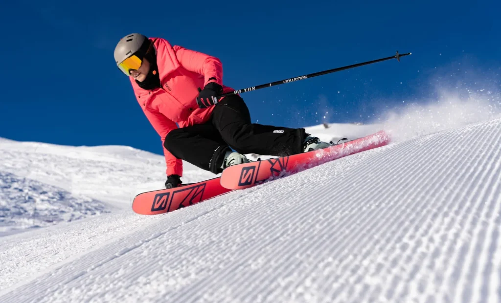Skier on groomed slopes