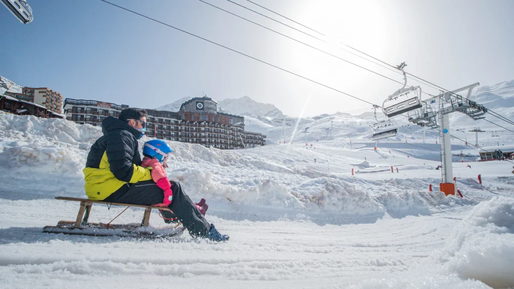 Sledging on the piste aux étoiles in Val Thorens